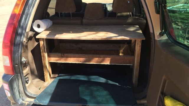 This will be my home. Again. I'm excited about the  shelf-ish that I created for greater organization--because that is the biggest challenge of life on the road. To make it even better, it's all abandoned/found wood and carboard. I didn't have to buy anything new to make it!